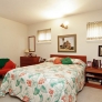 mid-century-bedroom-with-pinch-pleat-drapes