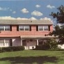 1969-large-pink-siding-house-landscape