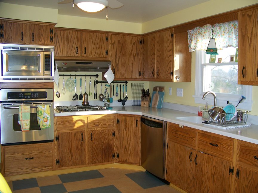 1963 Retro Oak Kitchen Yellow and Aqua Linoleum Floors Diana's early 60s oak kitchen with plank doors and colonial hardware
