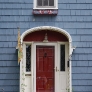 1920s-blue-house-with-red-door