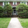 brick-colonial-house-with-mill-finish-screen-door