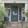 greay-stucco-colonial-with-teal-trim