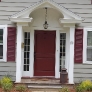 grey-colonial-house-with-burgundy-door