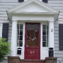 grey-colonial-house-with-red-door
