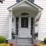white-colonial-house-with-blue-shutters