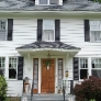 white-colonial-house-with-oak-door