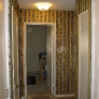 hallway with flocked wallpaper