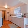 white-laminate-kitchen-wood-floor