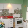 youngstown-kitchen-red-counters-green-walls-red-and-green-tile-backsplash
