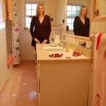 Cindy's bathroom has great balance between what's going on with the tile and what's going on with the walls. I'd call it -- artsy/eclectic...When I was in it, I didn't think "pink," I thought "pretty." That's my pretty sister Jenni BTW.