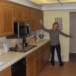 connie in her kitchen painted with rustoleum cabinet transformations