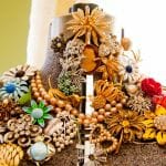 collaging with costume jewelry onto a dressmaker dummy