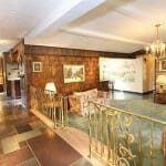 Mid-century-living-room-with-slate-floor-and-stone-walls