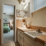 mid-century-tan-ceramic-tile-bathroom