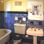 new-american-universal-20s-blue-black-tile-bathroom