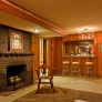 knotty-pine-rec-room-with-sputnik-light-and-fireplace