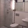 honed-marble-shower-in-mondrian-bathroom