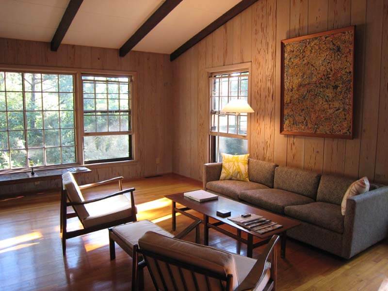 living room with pecky cypress paneling