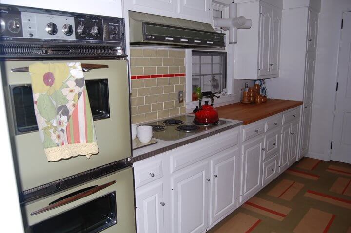 50s kitchen with avocado stove, range top and hood