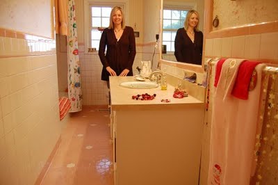 Cindy's bathroom has great balance between what's going on with the tile and what's going on with the walls. I'd call it -- artsy/eclectic...When I was in it, I didn't think "pink," I thought "pretty." That's my pretty sister Jenni BTW.