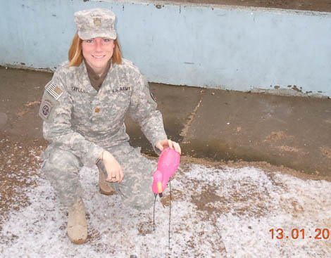 mariah with a pink flamingo in afghanistan