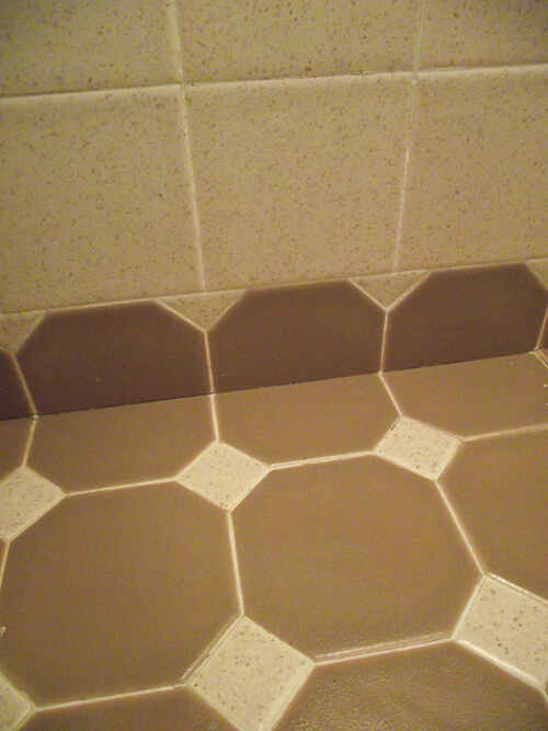 octagon and dot tile used as bottom wall edge to create scallop look