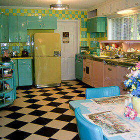 blue yellow and pink kitchen with black and white checkerboard floors