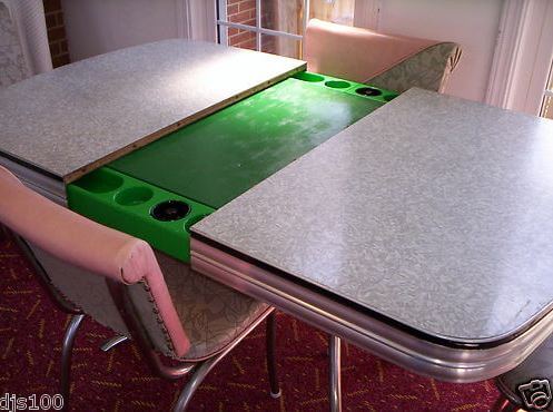a kitchen table that opens to reveal a poker table -- a Playdine