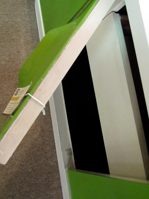 how green plastic is adhered to the door of broyhill 1970s plastic furniture