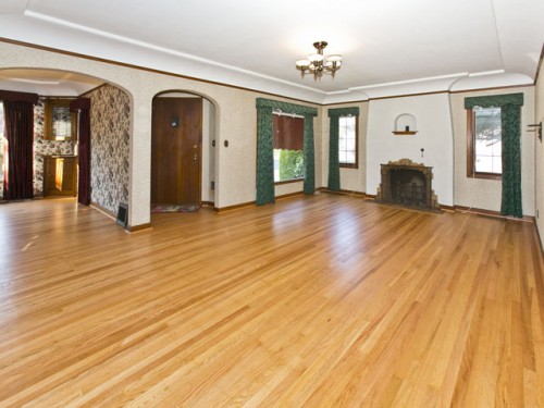 1940 living room with coved ceiling and original hardwood floors