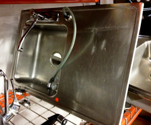 vintage stainless steel drainboard sink spotted at a restore habitat for humanity