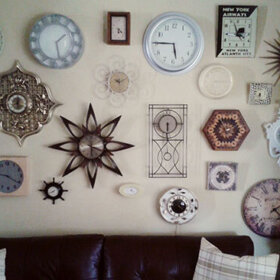 wall of vintage clocks