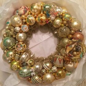 Christmas ornament wreath made with mostly gold ornaments