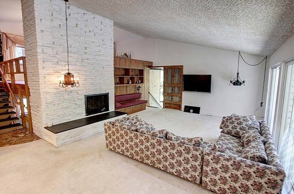 groovy family room with roman brick fireplace 