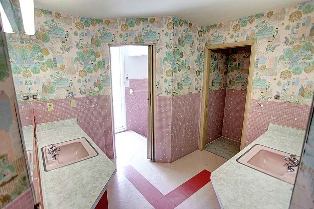 mid century master bathroom with two vanities