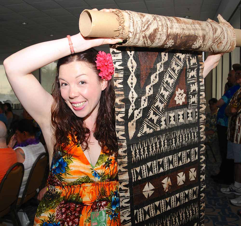 kate holding a big roll of vintage tapa cloth