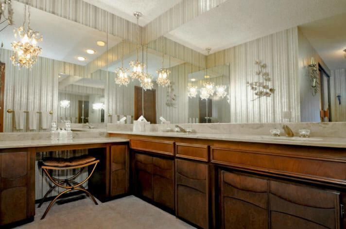 1972 bathroom with wood cabinets and lots of mirror