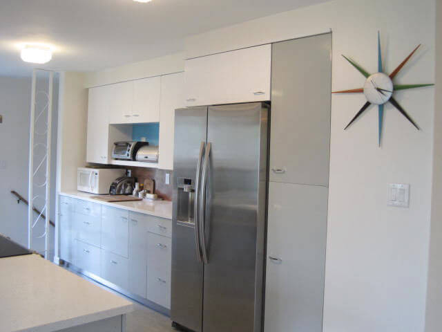 counter depth refrigerator in a midcentury modern kitchen