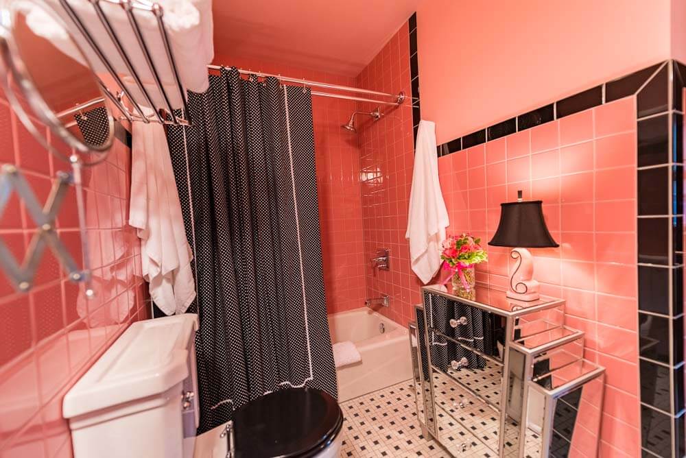 pink tile bathroom with black trim