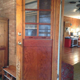 vintage wood door with sliding window cover