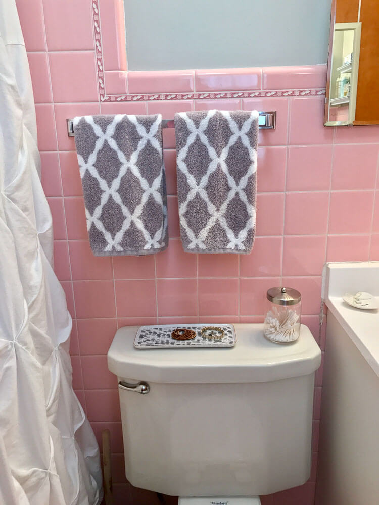 pink bathroom tile with decorative trim