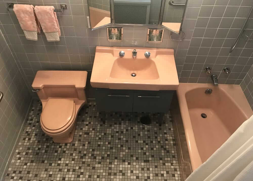 bathroom with vintage american standard fixtures in pink