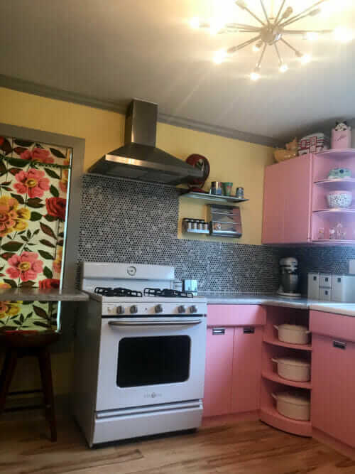 pink kitchen with retro stove