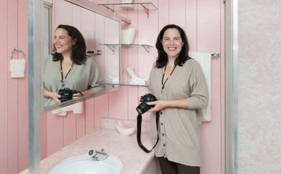 Pam Kueber in Wilson House pink bathroom 