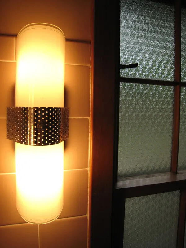 beautiful vintage bathroom sconce with two bulbs