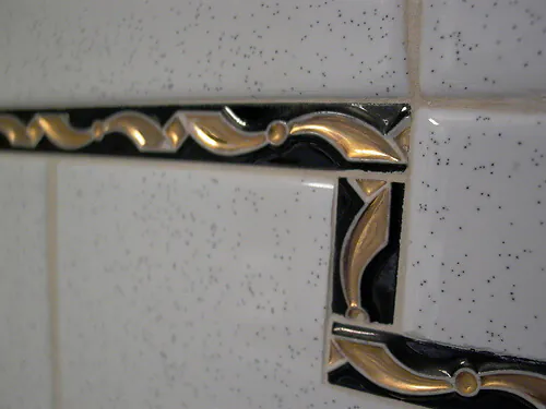 Retro salt and pepper tile with black and gold liner