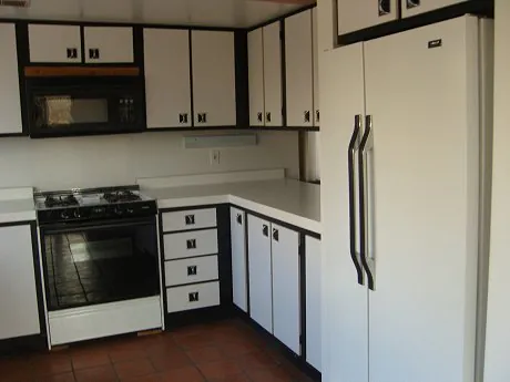 1976 kitchen with black and white laminate cabinets