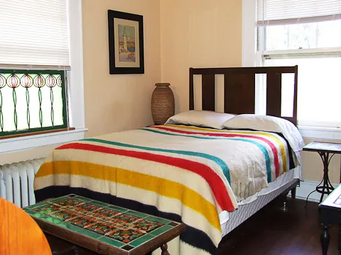 bungalow bedroom with pendelton blanket