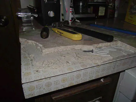 removing tile from a laminate countertop