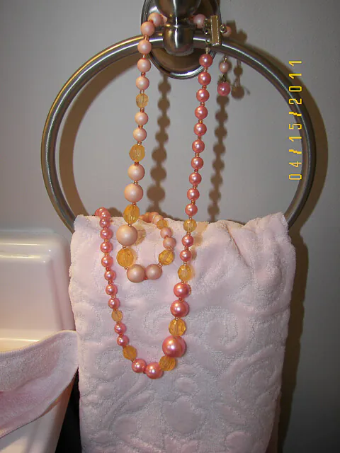 bathroom towels decorated with vintage costume jewelry